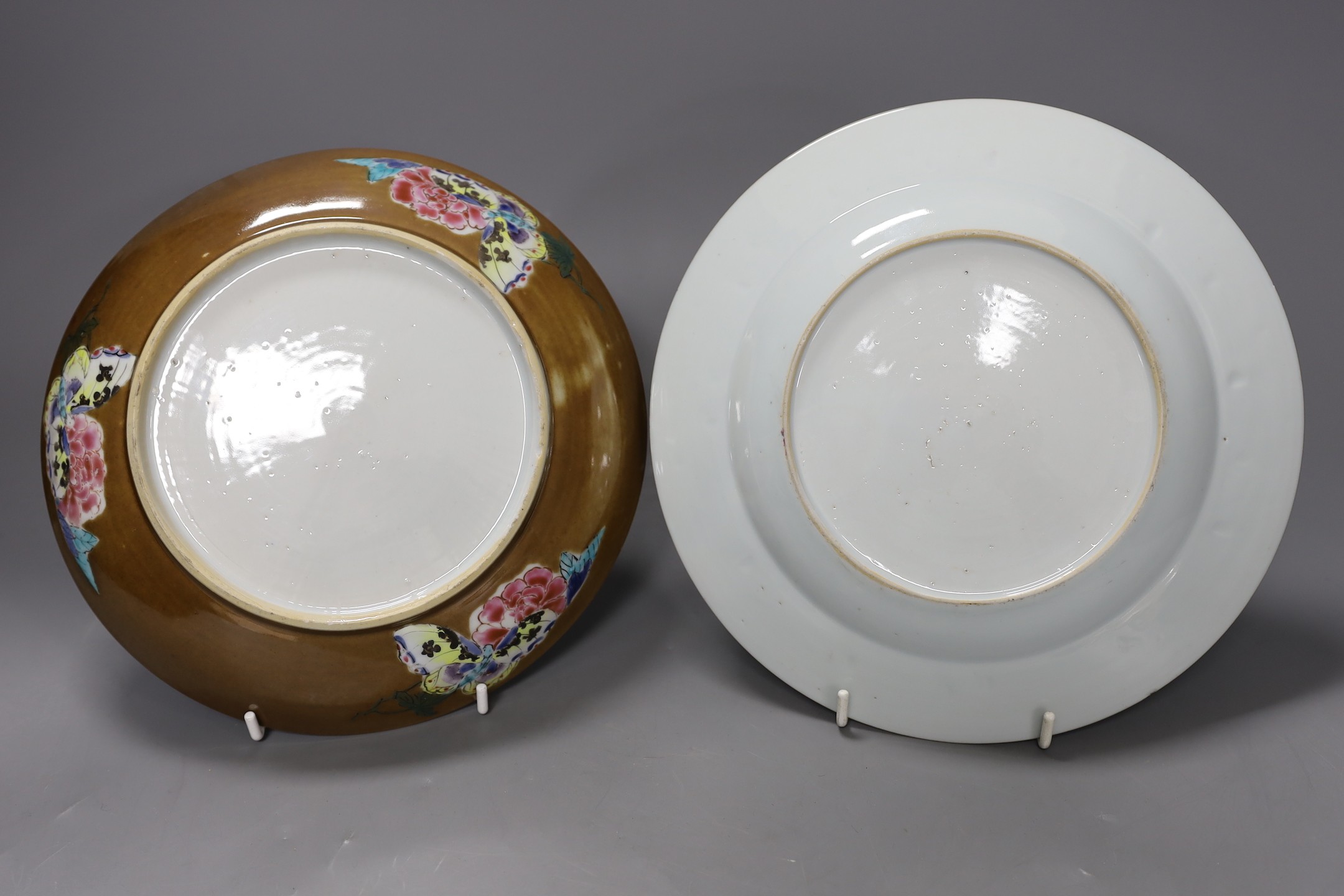 A Set of three 18th century Chinese export famille rose plates and a similar dish, largest 22.5cm diameter